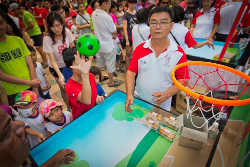 Children participating in basketball carnival game
