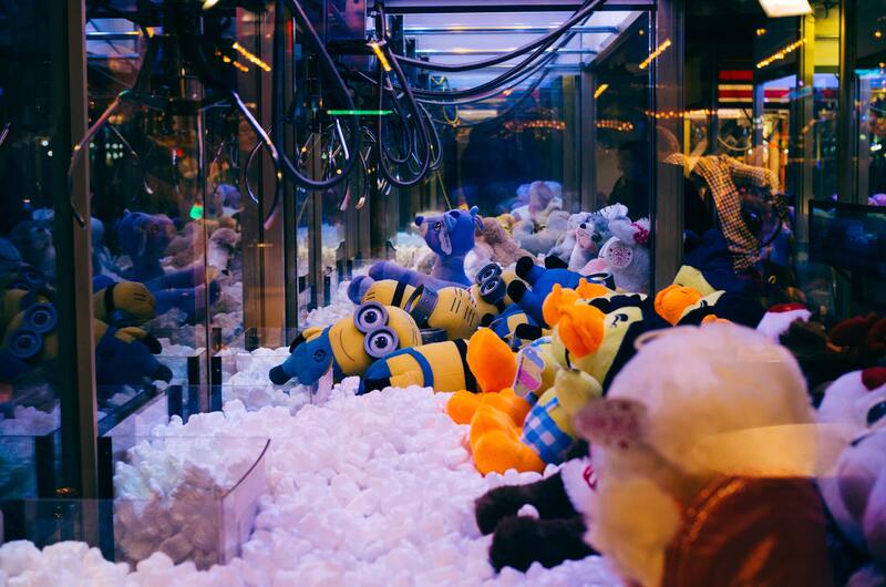 Claw machine with Minion soft toys as prizes