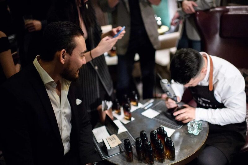 Craftsman customising leather goods at dinner and dance