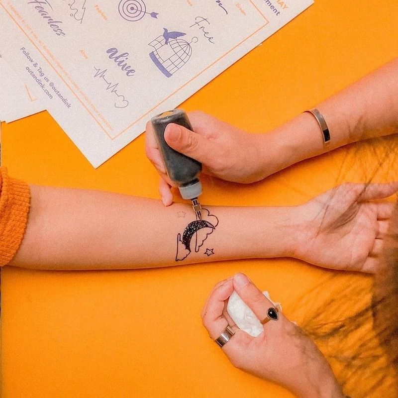 Getting a temporary tattoo at a dinner and dance