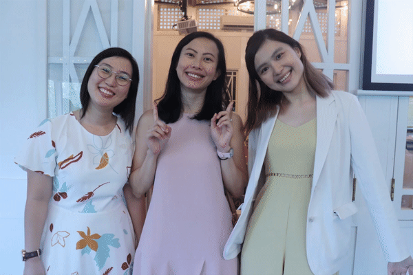 3 women posing for event photographer in GIF