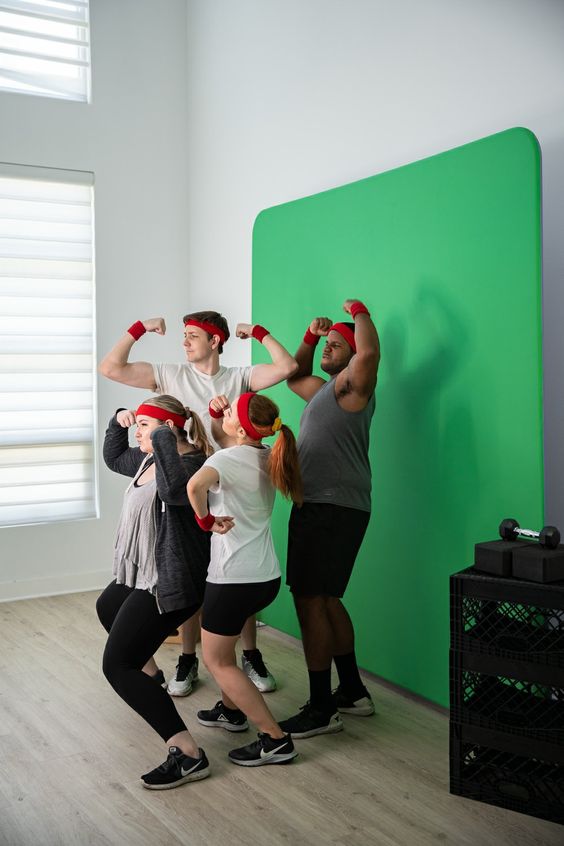 FItness group posing together promotional photoshoot for backdrop green screen event promotion photobooth posing