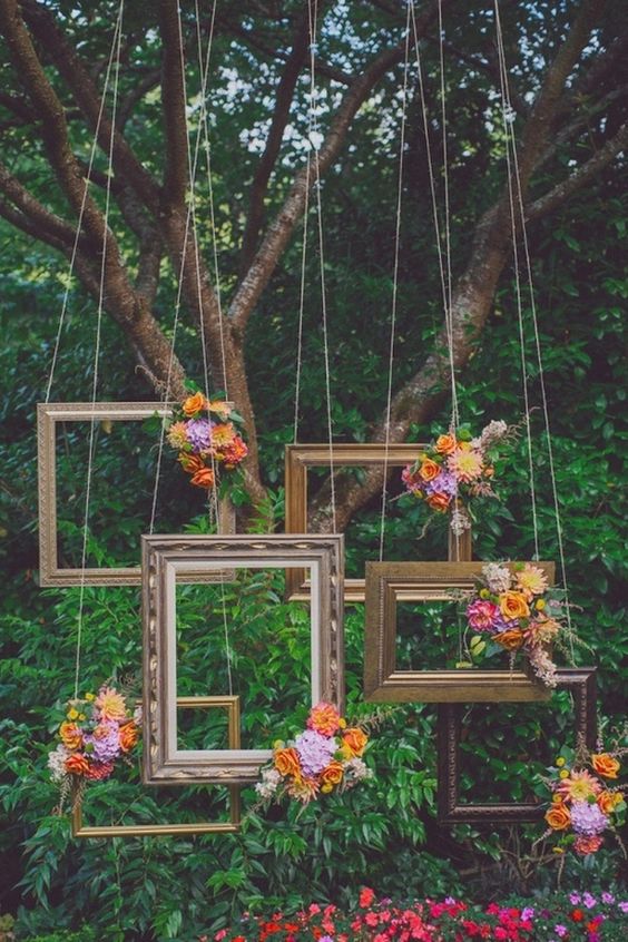 Frames hanging from a tree for backdrop photoshoot photobooth wedding